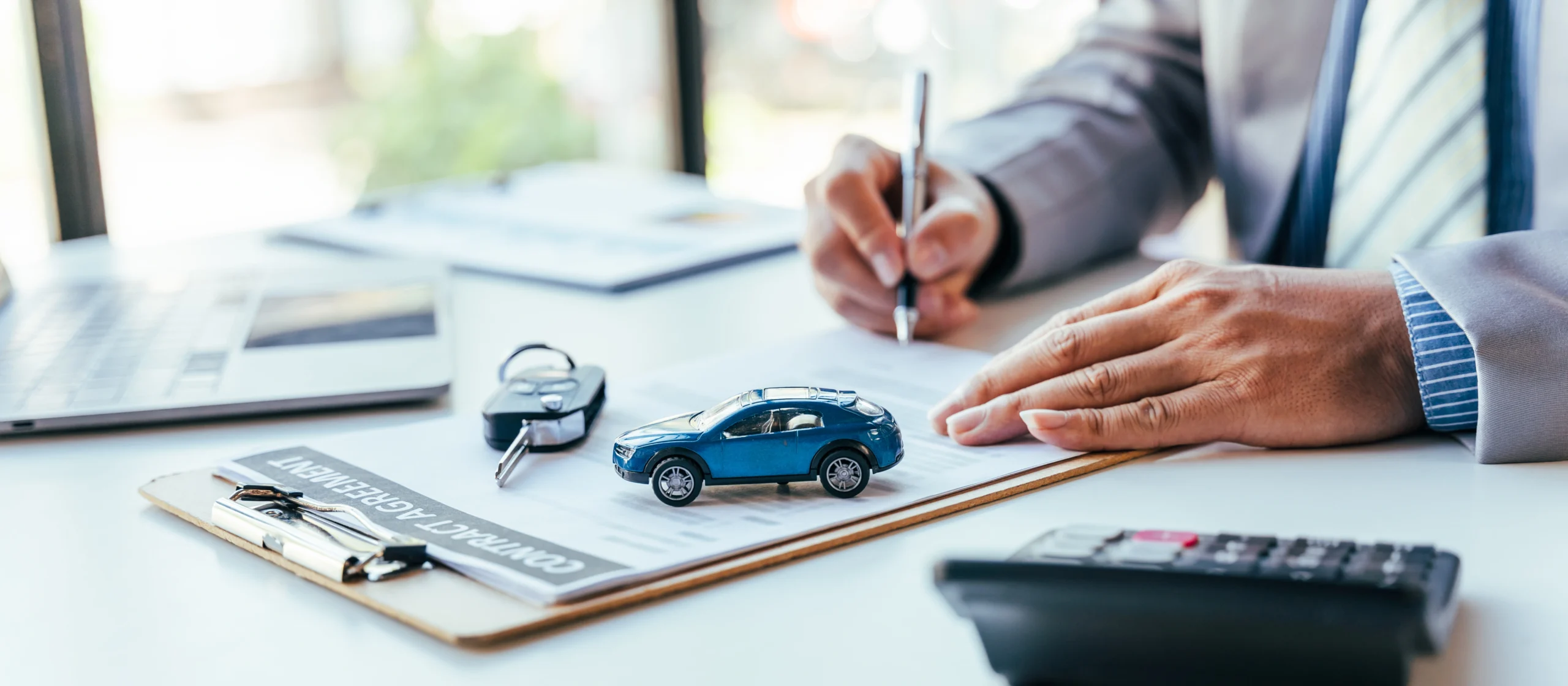 signing car purchase agreement