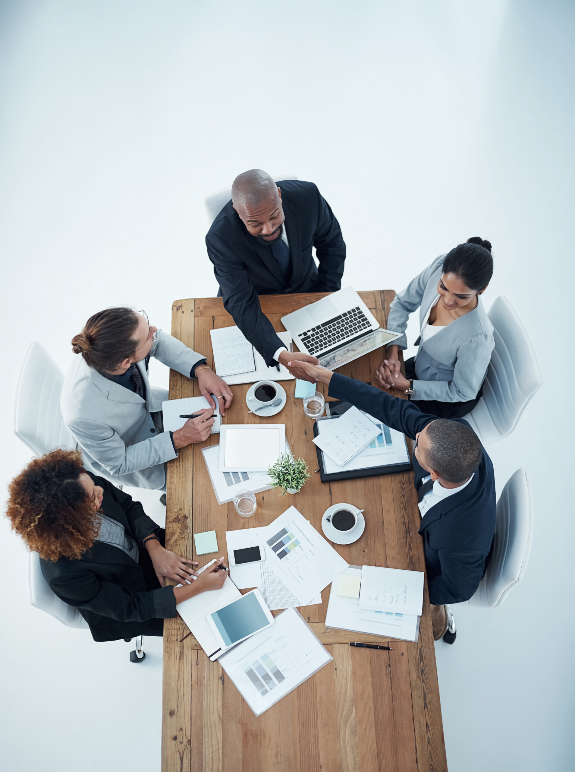 employees around a table in a meeting