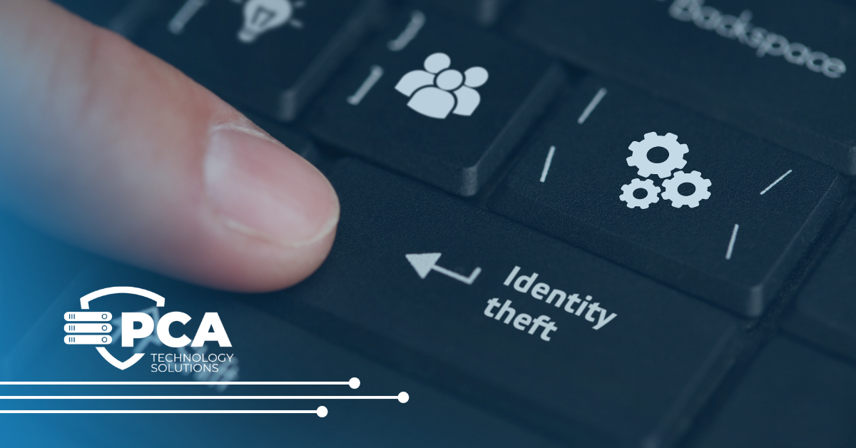 Finger near a keyboard key labeled 'Identity theft' with white gear icons and a PCA Technology Solutions logo in a blue-tinted banner, conveying cybersecurity focus.